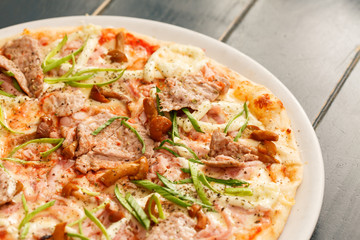 pizza with beef and mushrooms