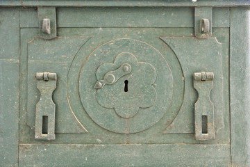 The old antique iron safe background.