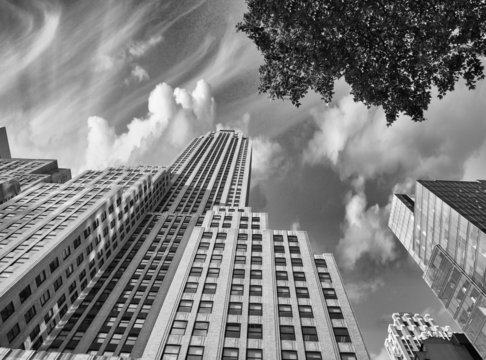 Fototapeta Street view of tall skyscrapers in Manhattan - New York