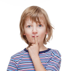 Boy Looking Thinking, Finger on his Mouth