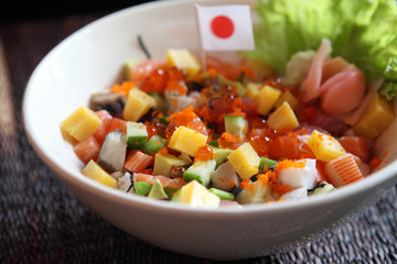 Sushi don , raw salmon tuna octopus on rice