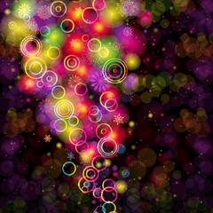 Abstract colorful rings and snowflakes on a dark background.