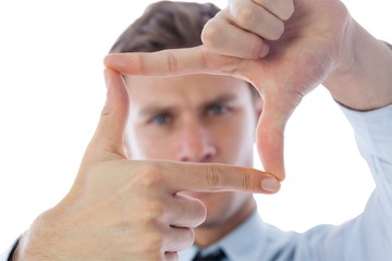 Businessman making frame with hands