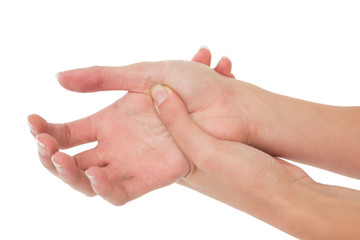 Close-up of a young woman touching her palm