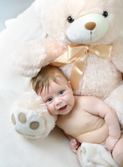 cute funny infant baby boy with big bear, beautiful kid's portra