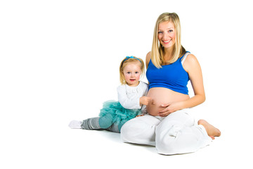 Pregnant woman with 2 zo daughter on white