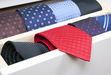 Neckties in wooden box