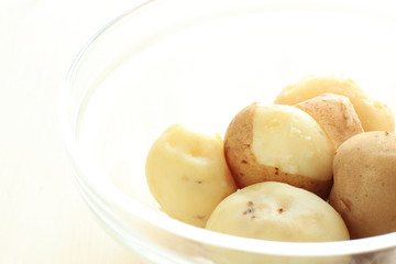 boiled potato on glass bowl
