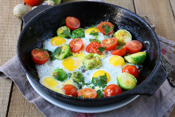 vegetable fried eggs in a frying pan