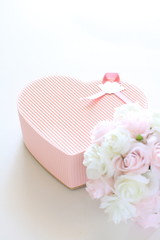 heart shaped present and flower bouquet