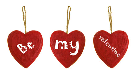 Be my Valentine three wooden Hearts on a white background