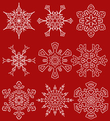 Obraz na płótnie Canvas Set of drawn snowflake silhouettes