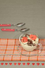 Valentine's Day tiramisu with chocolate in glass cup.