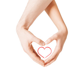 Obraz premium woman and man hands showing heart shape