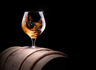Cognac or brandy on a black