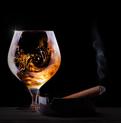 Cognac glass shrouded in a smoke