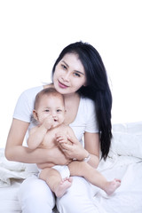 Fototapeta na wymiar Attractive mother and baby - isolated