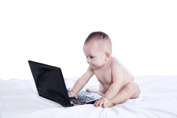 Happy baby with laptop - isolated