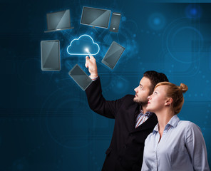 Happy couple touching cloud service