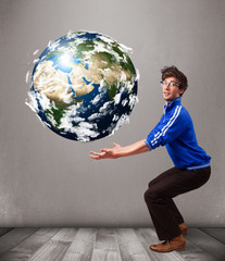 Good-looking man holding 3d planet earth
