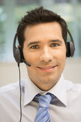 Businessman in the office on the phone with headset