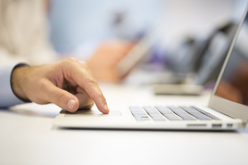 Close-up of  businessman hands typing on laptop in Office