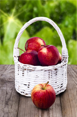 Apples in a white wicker basket