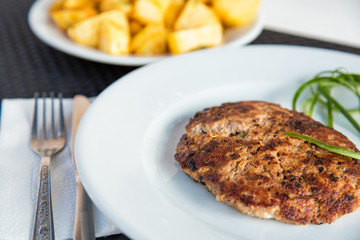Grilled meat cutlet served