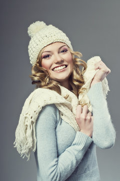 winter picture of beautiful smiling woman wearing woolen sweater