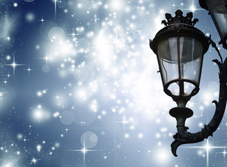 Fototapeta na wymiar Christmas greeting card - white night with stars and street lamp