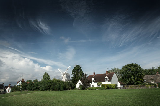 Street view of cottages and windmill in Finchingfield, England