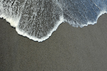 Wave on the sand