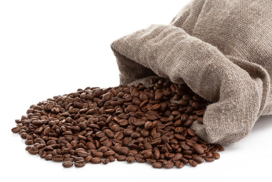 roasted coffee beans with cloth sack isolated on white
