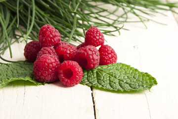 natural raspberries on white background