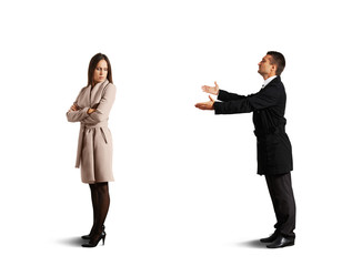 sorrowful woman standing near young man