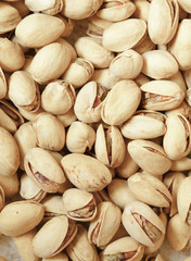 Closeup of pistachios in nut shells as food background