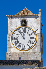 European church with tower and huge clock