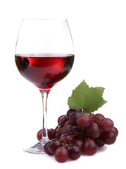 glass of wine and grapes, isolated on white