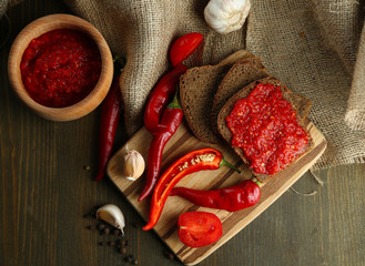 Composition with salsa sauce,, red hot chili peppers  and