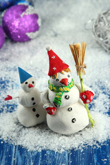 Beautiful snowmen and Christmas decor, on bright background