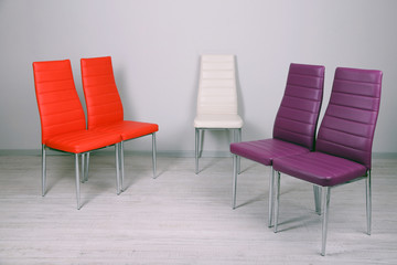 Modern  color chairs on wall background