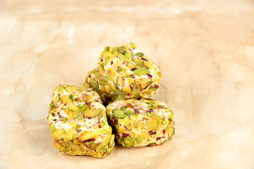 Tasty oriental sweets (Turkish delight), on brown background