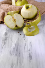 Apples and sackcloth on  on wooden background