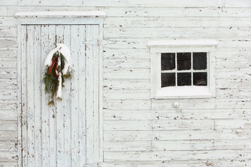 Old Door and Window with White Peeling Paint and Wreath