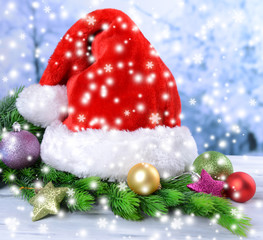 Composition with Santa Claus red hat and Christmas decorations