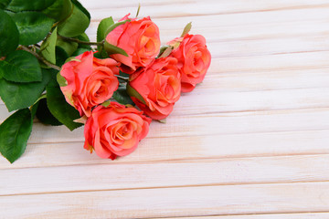 Fototapeta na wymiar Bouquet of beautiful artificial flowers, on wooden background