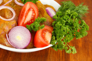 Turkey meat in bowl on wooden table close up