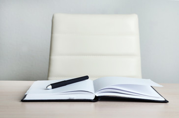 Empty workplace in office on gray background