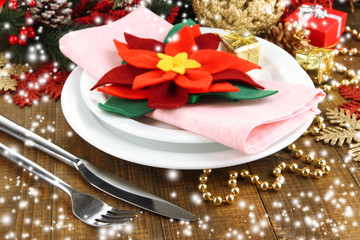 Christmas table setting with festive decorations close up