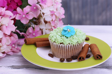 Tasty cupcake with butter cream,